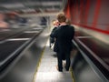 Man in moving escalator