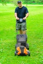 Man Mowing Grass Smiling Royalty Free Stock Photo