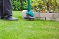 Man mowing lawn with grass trimmer Royalty Free Stock Photo