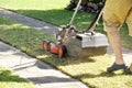 Man mowing lawn with lawn mower in the garden Royalty Free Stock Photo