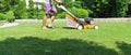 Man mowing the lawn with lawn mower in summer. Spring season sunny lawn mowing in the garden. Royalty Free Stock Photo