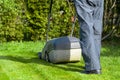 Man mowing with lawn mower in the garden Royalty Free Stock Photo