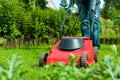 Man is mowing the lawn in summer Royalty Free Stock Photo