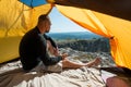 Man with a mug in an camping outdoor