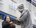 Man Mugging Woman In Street Royalty Free Stock Photo