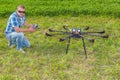Man with multicopter on ground