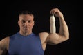 Man with muscular body and biceps hold yoghurt bottle Royalty Free Stock Photo