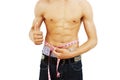 Man with a muscular body measuring his abs Royalty Free Stock Photo