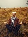 Man with mushroom on head, mushroom as a umbrella.