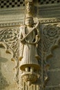 A man with musical instrument and snake cobra on his body carved in stone on the wall of Maheshwar Temple Royalty Free Stock Photo