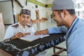 Man muslim learing to reading quran together during ramadan