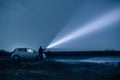 Man with flashlight in outdoor at night Royalty Free Stock Photo