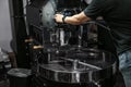 Man near coffee roaster machine indoors, closeup Royalty Free Stock Photo