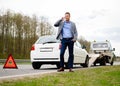 Man near his broken car on a roadside Royalty Free Stock Photo