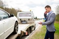 Man near his broken car on a roadside Royalty Free Stock Photo