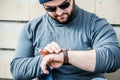 Man nervously looking at his watch Royalty Free Stock Photo