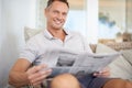 Man, newspaper and happy in portrait on sofa to relax with reading, knowledge and information in home. Person Royalty Free Stock Photo