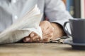 Man newspaper reading on table Royalty Free Stock Photo