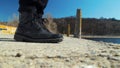 Foots of a man next to a lake Royalty Free Stock Photo