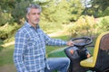 Man next to mower Royalty Free Stock Photo