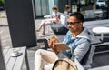 Man with notebook and coffee at street cafe Royalty Free Stock Photo