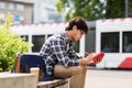 Man with notebook or diary writing on city street Royalty Free Stock Photo