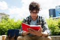 Man with notebook or diary writing on city street Royalty Free Stock Photo