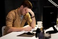 Man with notepad working late at night office Royalty Free Stock Photo