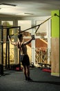 Man with nude torso, and muscular back in gym enjoy training, trx. Sport and gym concept. Man with torso, sportsman Royalty Free Stock Photo