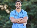 Man, nurse portrait and arms crossed of healthcare and wellness professional outdoor. Success, doctor motivation and Royalty Free Stock Photo