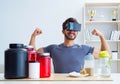 Man with nutrition jars and virtual reality glasses Royalty Free Stock Photo