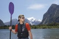Man With Oar In Front Of Mountain Lake Royalty Free Stock Photo