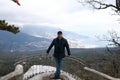 Man on observation deck of silver gazebo