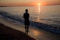 Man observes beautiful sea sunset Royalty Free Stock Photo