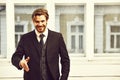 Man offer cooperation with happy face in black jacket, tie Royalty Free Stock Photo