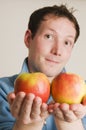 Man offer two apples Royalty Free Stock Photo