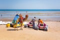 Man offering camel ride on the beach of Hurghada