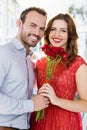 Man offering flower bouquet to woman