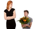 Man offering flowers to his angry girlfriend Royalty Free Stock Photo
