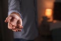 Man offering helping hand on blurred background, closeup. Royalty Free Stock Photo