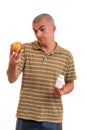 Man offering pill in one hand and apple in another. Royalty Free Stock Photo