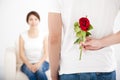 Man offering rose to his girlfriend