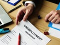Man offers empty Unemployment insurance form for signing Royalty Free Stock Photo