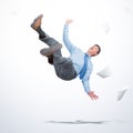 Man in office clothes falls down with sheets of paper on light background. Falling markets and bankruptcy concept.