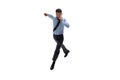 Man in office clothes practicing taekwondo on white background. Unusual look for businessman in motion, action. Sport