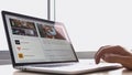 Man in an office laptop for reading news euronews in Facebook