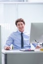 Man, office and portrait with pc and desk, happy and confident corporate male person sitting in workspace. Technology Royalty Free Stock Photo