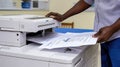 Managing paperwork effortlessly with the office printer.