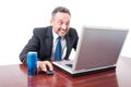 Man at office with psychotic look having energy drink Royalty Free Stock Photo