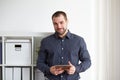 Man in office with tablet Royalty Free Stock Photo